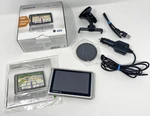 Garmin Nuvi 1300LM Gps Unit With Power Cable And Mount Used Bundle. Fixed Price $24.47.